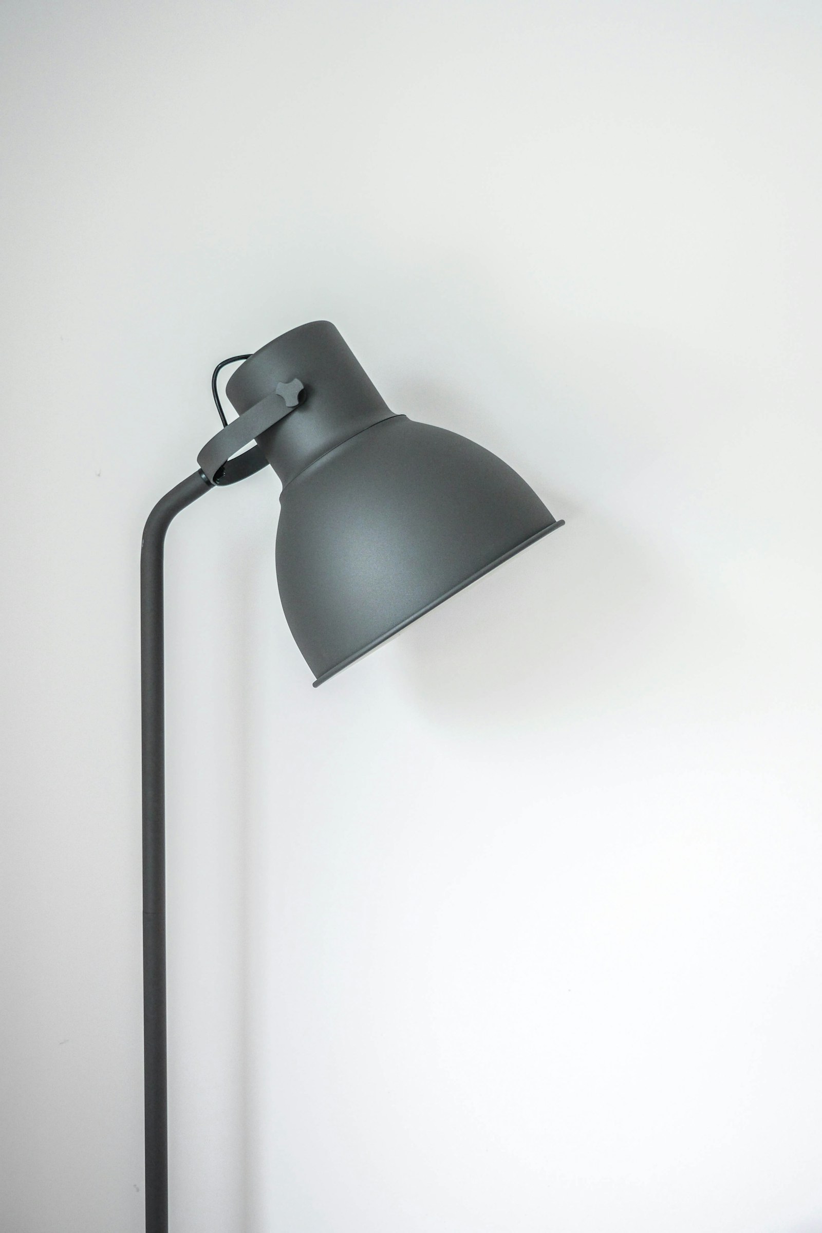 Adjustable task light against a pale background